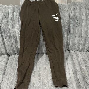 Nike Kids green Joggers with White Swoosh